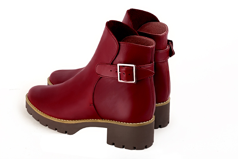 Cardinal red women's ankle boots with buckles at the back. Round toe. Low rubber soles. Rear view - Florence KOOIJMAN